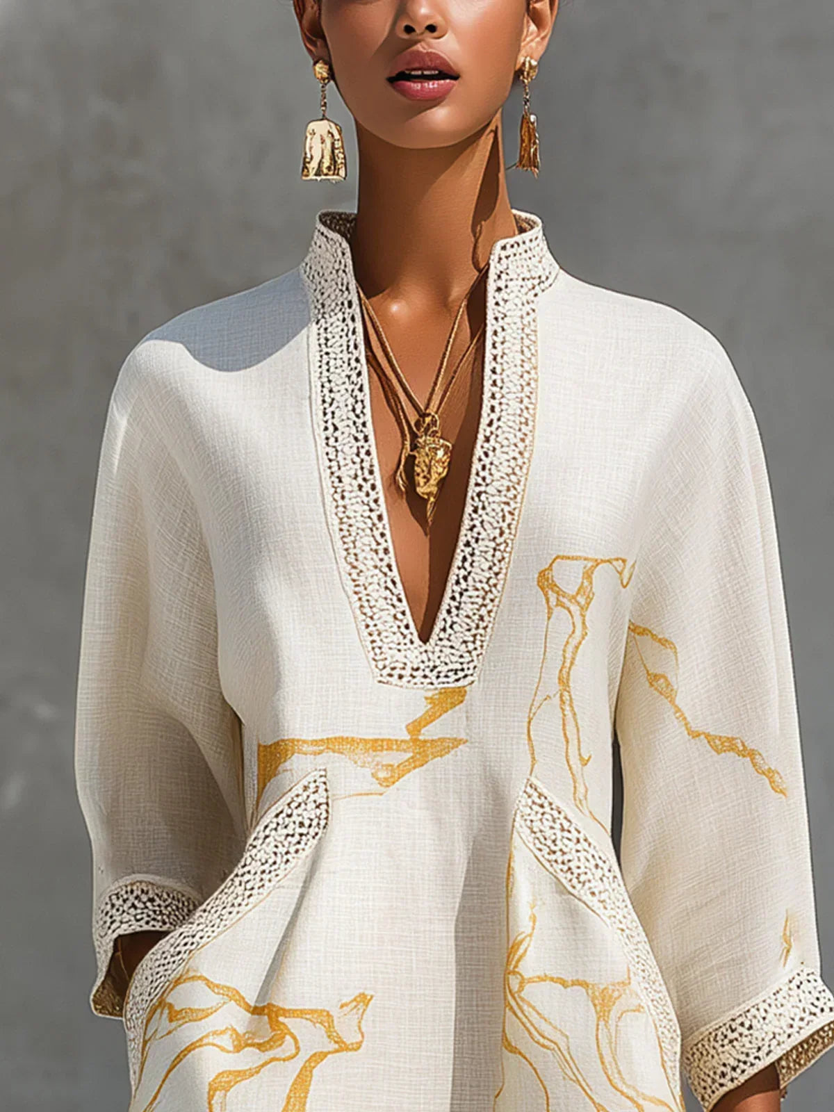 Renata - Short lace dress with golden print and deep V-neck