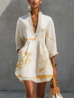 Renata - Short lace dress with golden print and deep V-neck