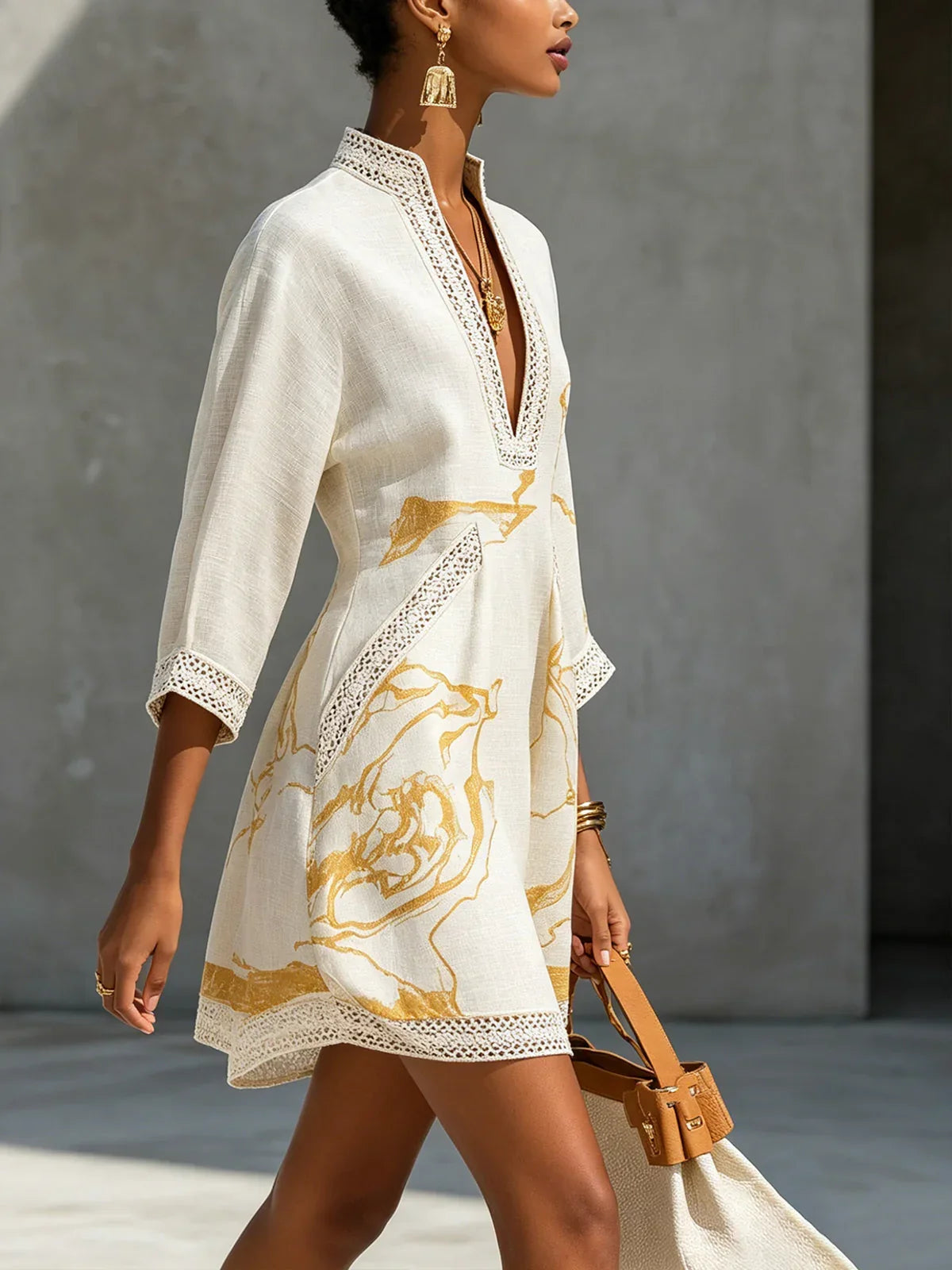 Renata - Short lace dress with golden print and deep V-neck