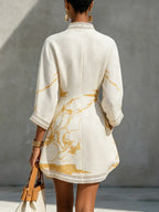 Renata - Short lace dress with golden print and deep V-neck
