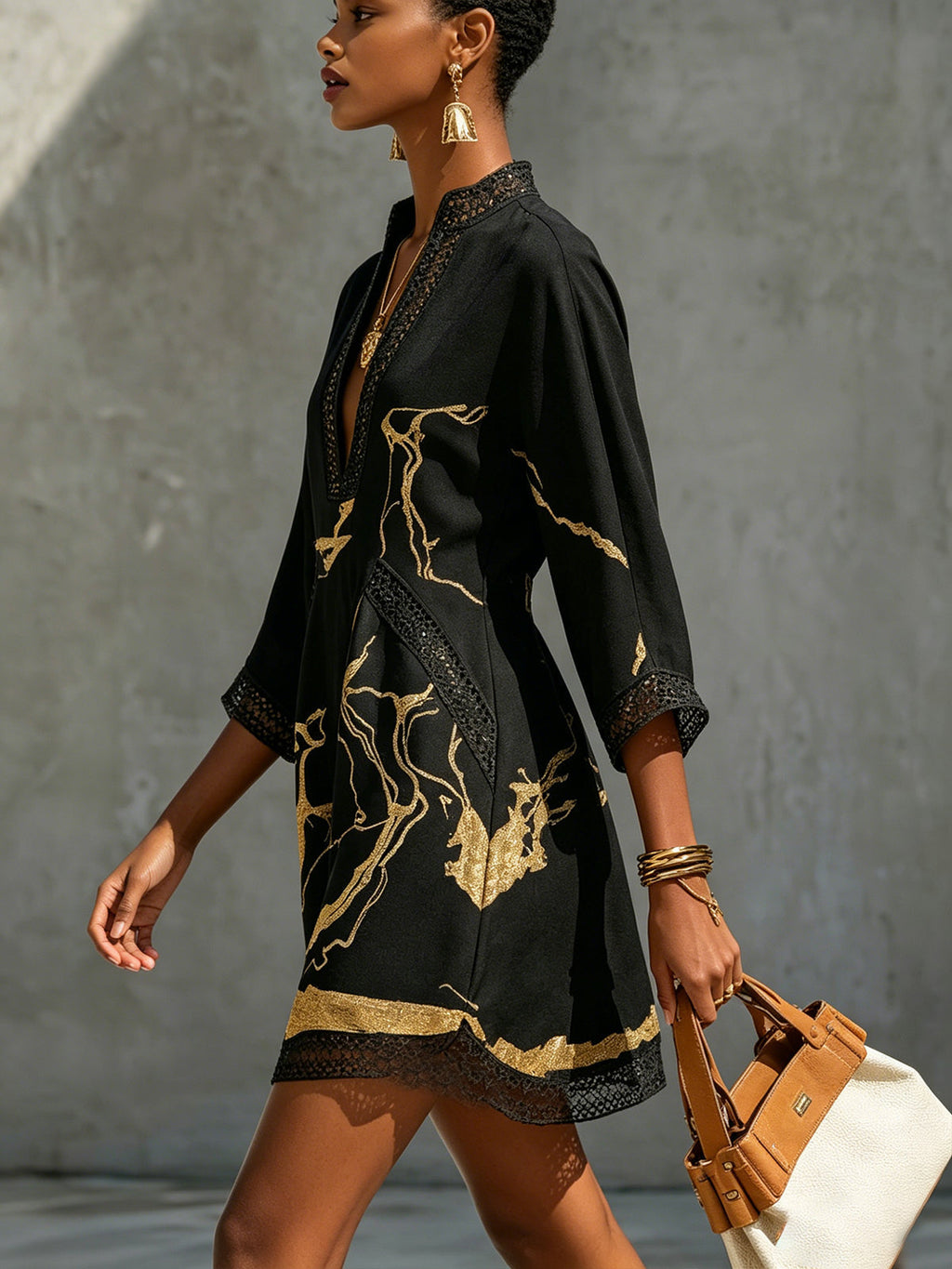 Donatella - Black mini dress with golden marble print and crochet lace